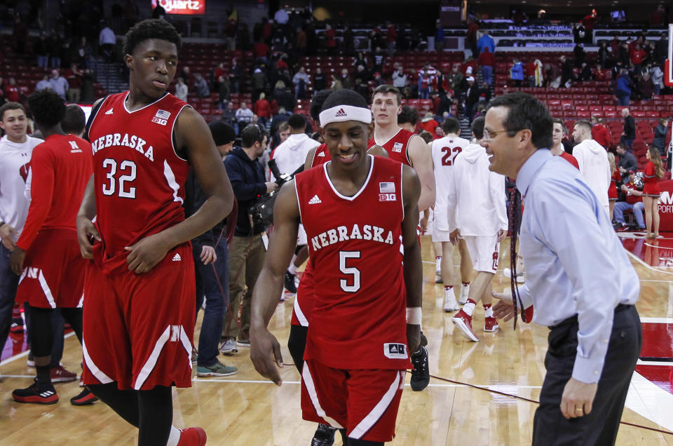 Nebraska head coach Tim Miles reacts to his players Jordy Tshimanga (32) and Glynn Watson (5) after Nebraska’s 74-63 win over Wisconsin in an NCAA college basketball game Monday, Jan. 29, 2018, in Madison, Wis. (AP Photo/Andy Manis)