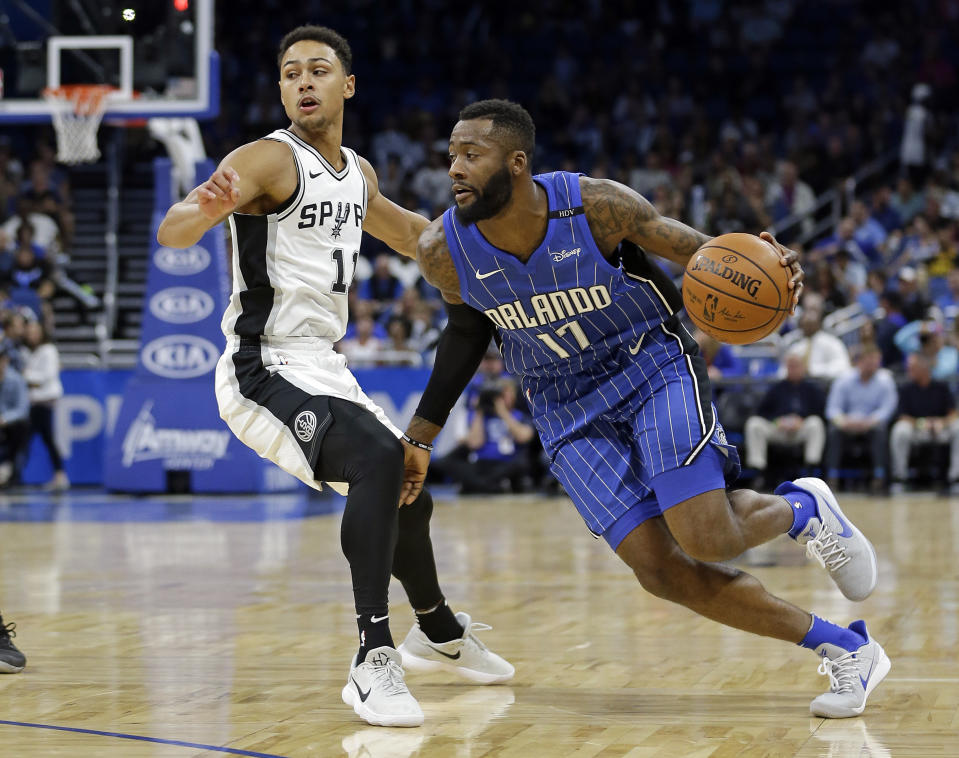 Orlando Magic's Jonathon Simmons (17) drives around San Antonio Spurs' Bryn Forbes, left, during the first half of an NBA basketball game, Friday, Oct. 27, 2017, in Orlando, Fla. (AP Photo/John Raoux)