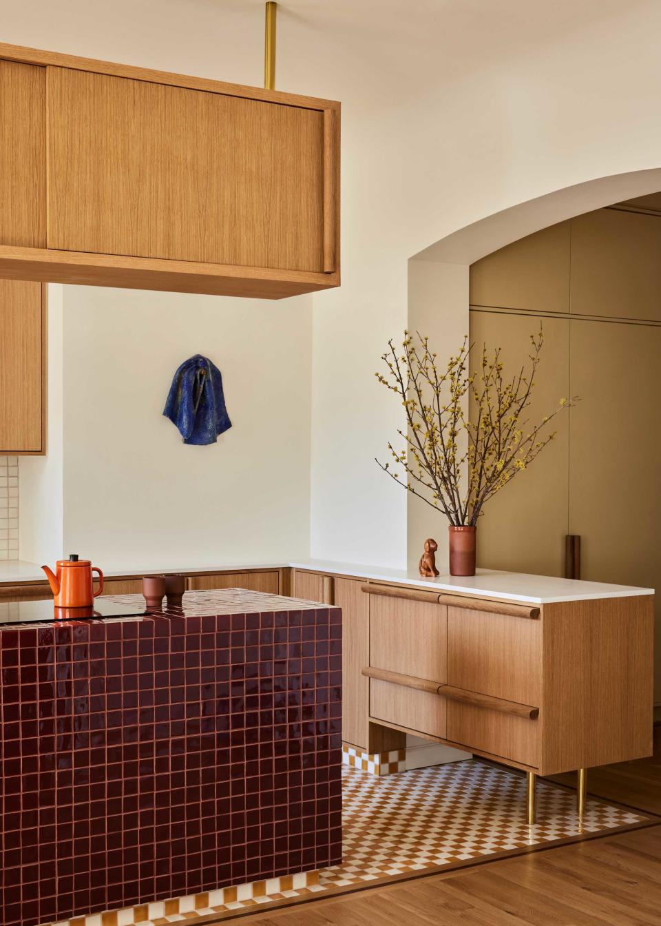 a kitchen with a tiled kitchen island