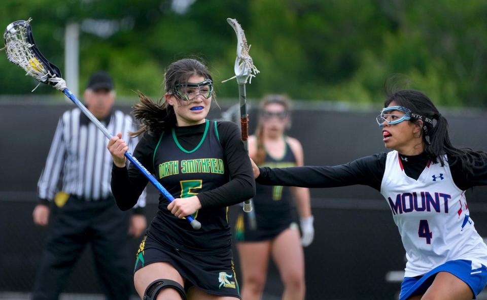 North Smithfield attacker, Kate Zonin, looks for a shot around Mount defender Kylana Chauvin in the first half.  