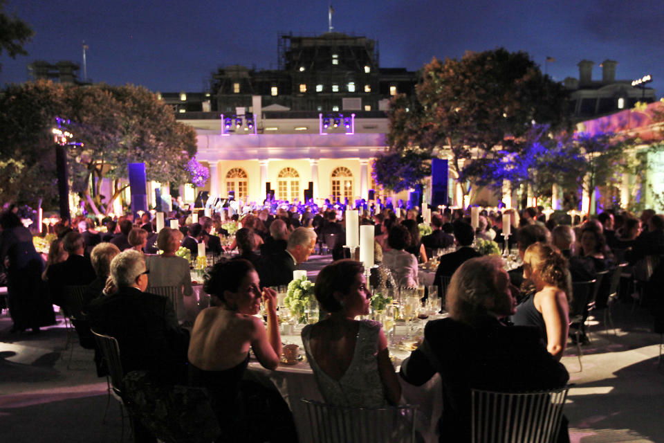 FILE - In this June 7, 2011, file photo, The White House host a State Dinner performance by members of the National Symphony Orchestra in the Rose Garden in honor of German Chancellor Angela Merkel. The National Symphony Orchestra canceled the five remaining performances in Japan of its Asian tour because of a new virus epidemic, according to an announcement on Thursday, Feb. 27, 2020. (AP Photo/Pablo Martinez Monsivais, File)