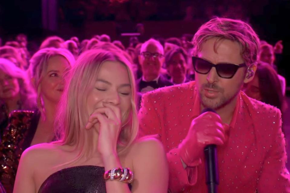 Ryan Gosling begins his performance of “I’m Just Ken” and “Barbie” star Margot Robbie hides herself from laughing on March 10, 2024. ABC