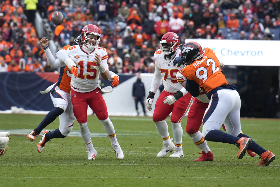 Kansas City Chiefs quarterback Patrick Mahomes (15) fumbles as he is hit by Denver Broncos linebacker Baron Browning during the first half of an NFL football game Sunday, Oct. 29, 2023, in Denver. The Broncos recovered the fumble. (AP Photo/David Zalubowski)