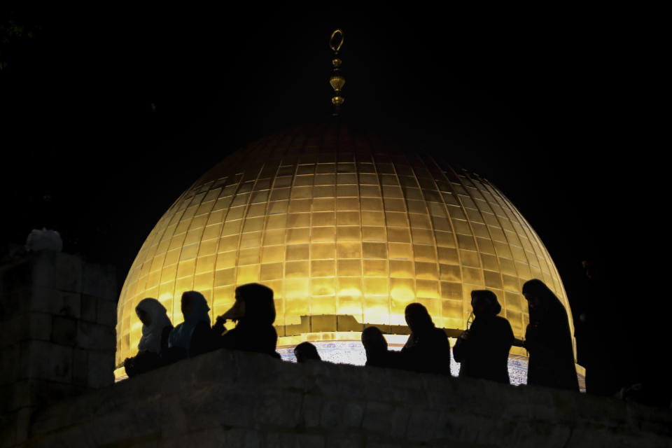 Palestinian Muslim worshippers pray during the Laylat al-Qadr, or the night of destiny, in the holy fasting month of Ramadan, in front of the Dome of the Rock Mosque at the Al Aqsa Mosque compound in Jerusalem's Old City Saturday, May 8, 2021. (AP Photo/Mahmoud Illean)