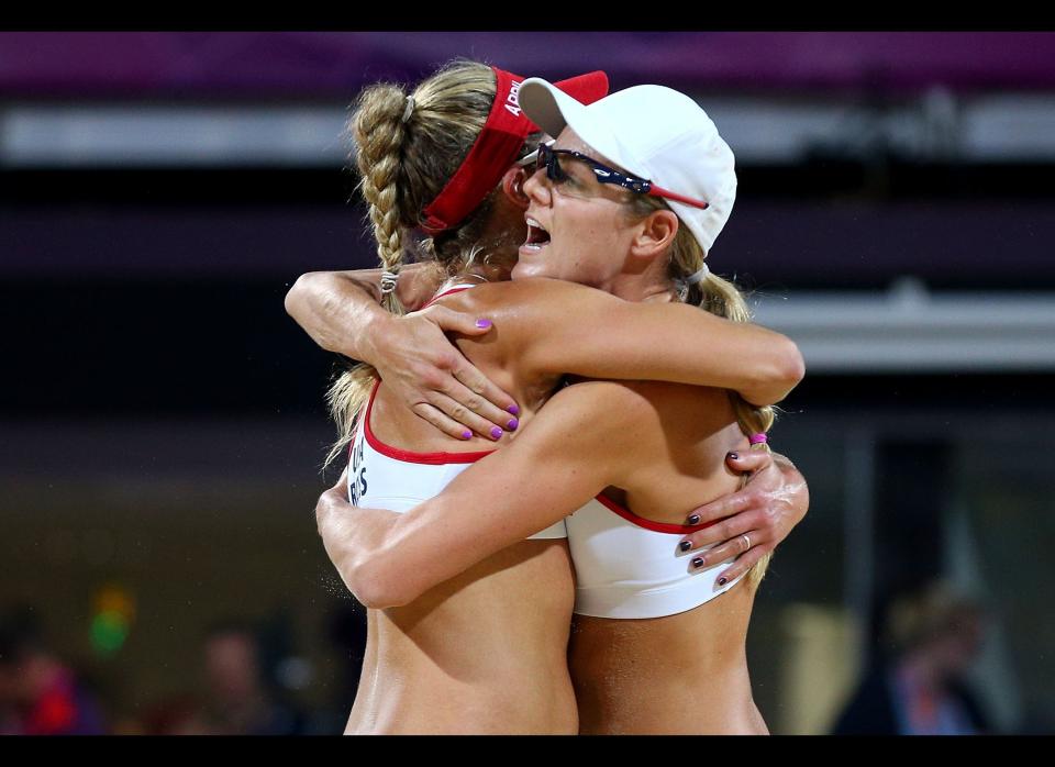 Jennifer Kessy and April Ross of the United States celebrate a point during the Women's Beach Volleyball Gold medal match on Day 12 of the London 2012 Olympic Games at the Horse Guard's Parade on August 8, 2012 in London, England. 