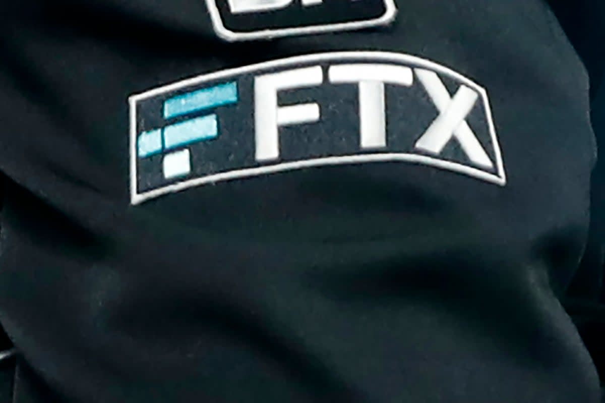 The FTX logo appears on home plate umpire Jansen Visconti's jacket at a baseball game with the Minnesota Twins on 27 September, 2022 (The Associated Press)