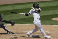 Chicago White Sox's Yoan Moncada hits a one-run double during the third inning of a baseball game against the Minnesota Twins in Chicago, Saturday, July 25, 2020. (AP Photo/Nam Y. Huh)