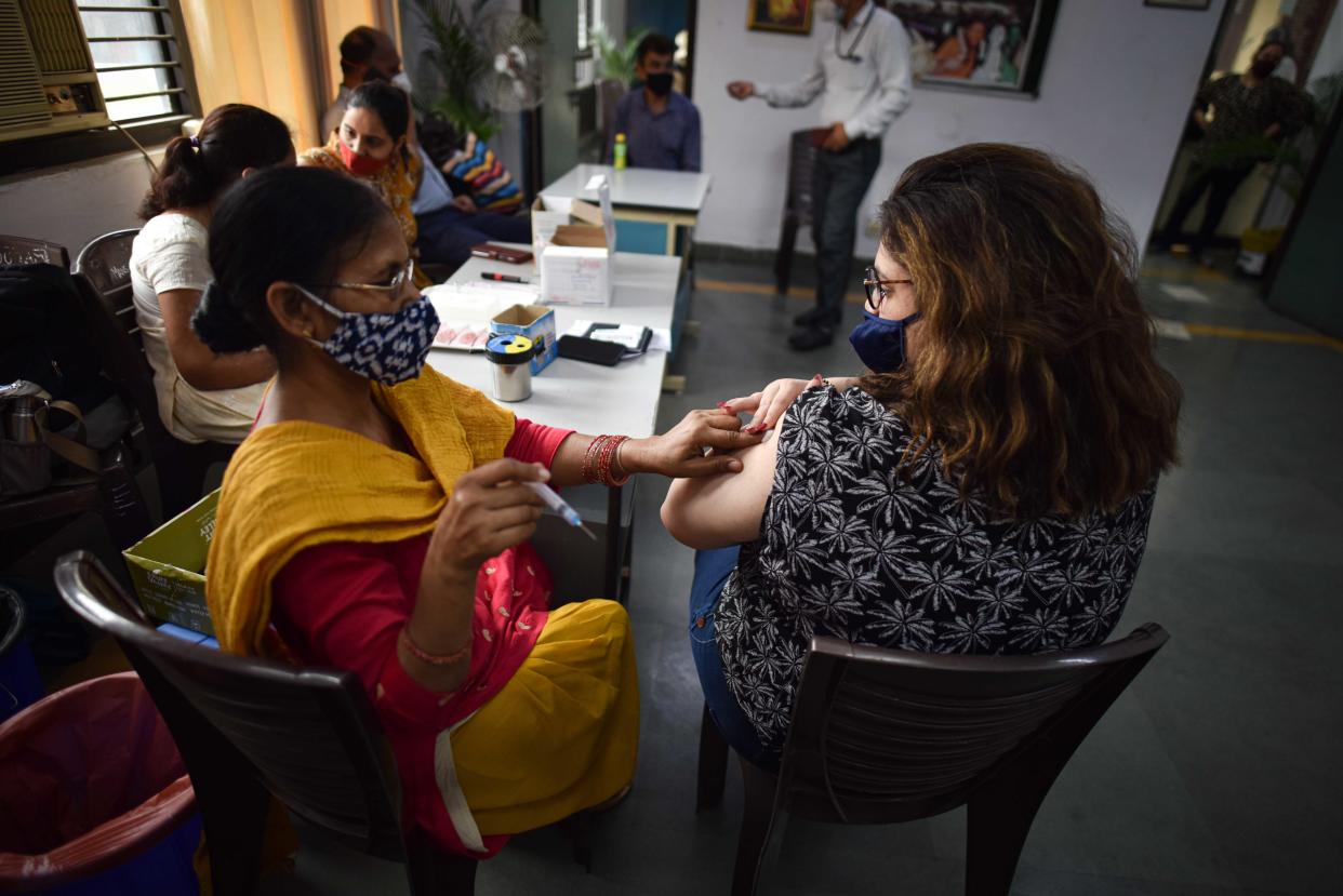 NEW DELHI, INDIA - JULY 9: A health worker administers a dose of Covid-19 vaccine to a beneficiary, at a vaccination centre, on July 9, 2021 in New Delhi, India. (Photo by Sanchit Khanna/Hindustan Times via Getty Images)