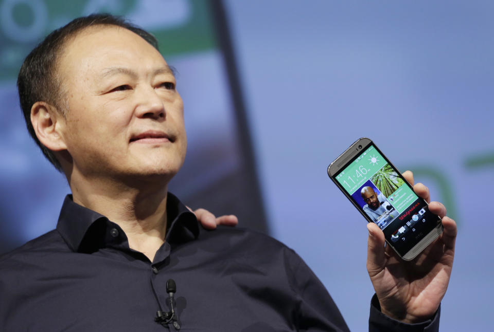 Peter Chou, CEO of HTC, introduces the new HTC One M8, Tuesday, March 25, 2014 in New York. (AP Photo/Mark Lennihan)