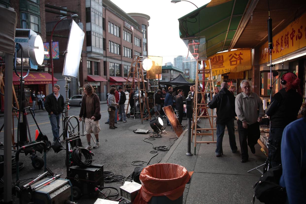 Vancouver, Canada - Oct. 01, 2009: Film crew setting up and filming movie at Vancouver Chinatown, in Vancouver, British Columbia, Canada