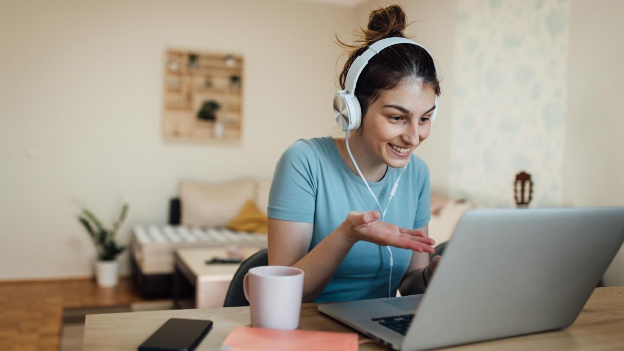 Young woman working from her home office during the quarantine due to Covid-19.