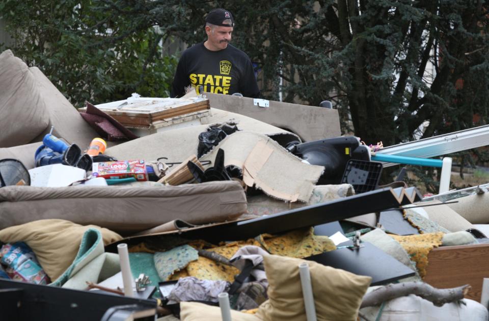 Sal Filannino of 47 Weber Ave. in Sayreville looks over the rumble of the interior of his home after raging flood waters filled the first floor of his home after superstorm Sandy.