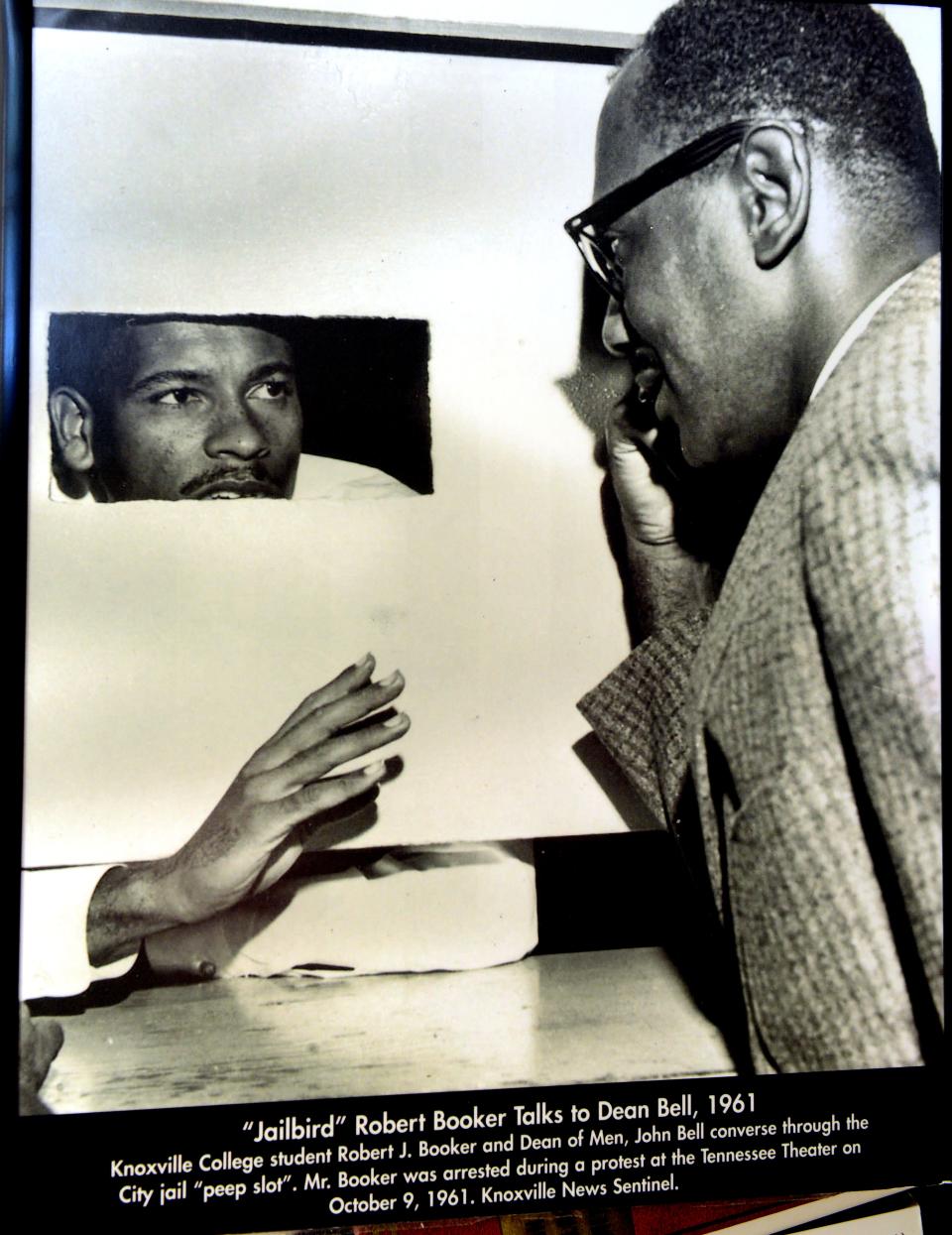 Robert Booker, then a student at Knoxville College, talks to Knoxville College Dean John Bell from a city jail cell after Booker's arrest during a protest at the Tennessee Theatre on Oct. 9, 1961.