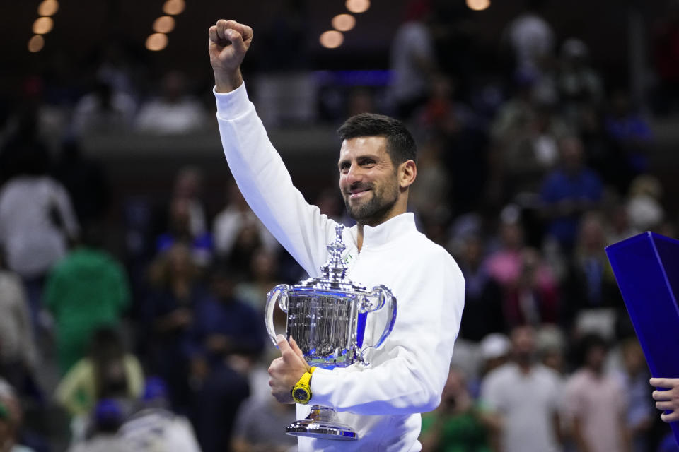 Novak Djokovic, of Serbia, holds the championship trophy after defeating Daniil Medvedev, of Russia, in the men's singles final of the U.S. Open tennis championships, Sunday, Sept. 10, 2023, in New York. (AP Photo/Frank Franklin II)