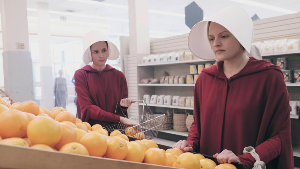 Two women shop for groceries in the TV version of "The Handmaid's Tale"