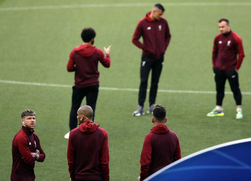 Liverpool's players inspect the pitch at the Camp Nou stadium in Barcelona, Spain, Tuesday, April 30, 2019. FC Barcelona will play against Liverpool in a first leg semifinal Champions League soccer match on Wednesday, May 1. (AP Photo/Manu Fernandez)