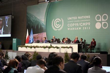 Delegates attend the 19th conference of the United Nations Framework Convention on Climate Change (COP19) at the National Stadium in Warsaw November 11, 2013. REUTERS/Agata Grzybowska/Agencja Gazeta