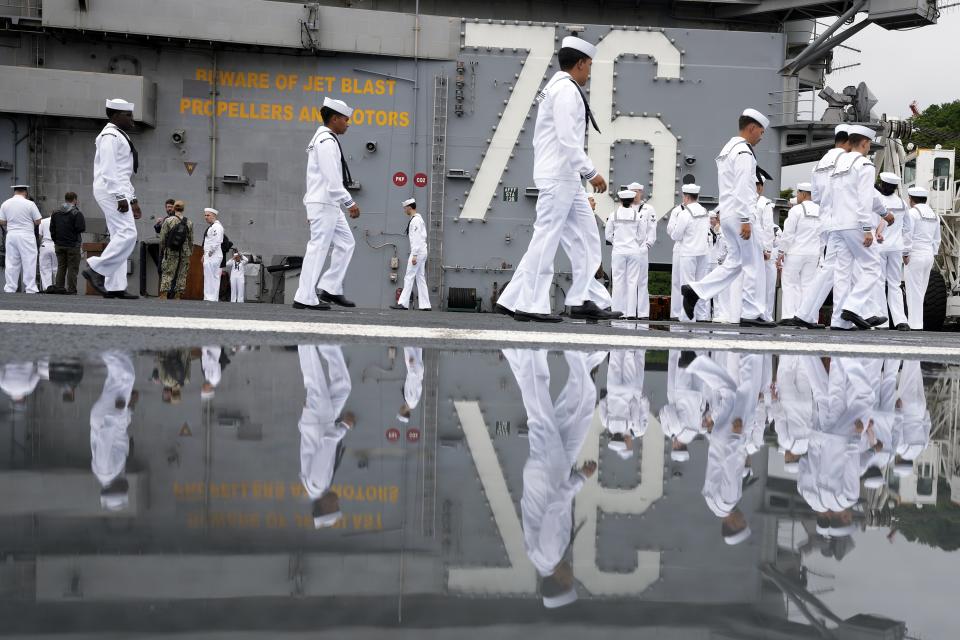 Crew of the U.S. navy aircraft carriers USS Ronald Reagan (CVN-76) rig a ship for the voyage at the U.S. navy's Yokosuka base Thursday, May 16, 2024, in Yokosuka, south of Tokyo. This is the ship's final departure from Yokosuka before transiting back to the United States. (AP Photo/Eugene Hoshiko)