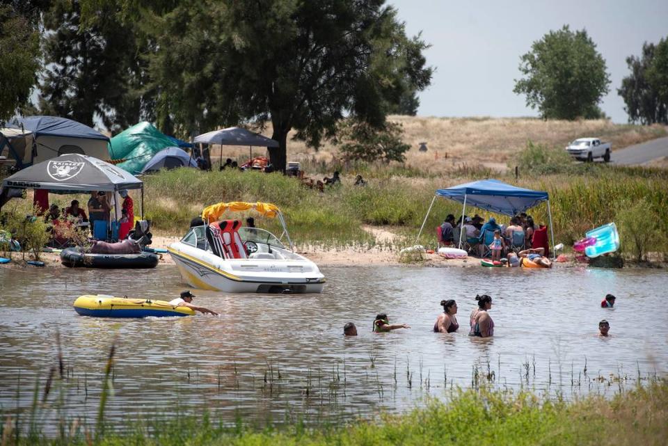 In this 2019 file photo, visitors to Woodward Reservoir enjoy the water on a warm July day.
