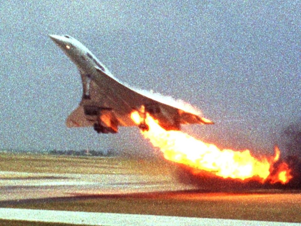 Air France's Concorde flight 4590 takes off with fire trailing from its engine on the left wing from Charles de Gaulle airport in Paris in this July 25, 2000 photo.