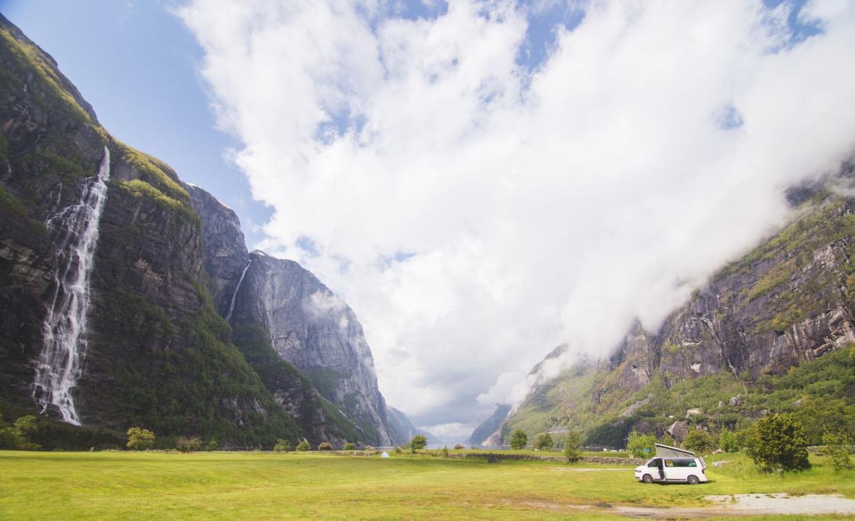 View of camper van in Norwegian fjord landscape in Besseggen.