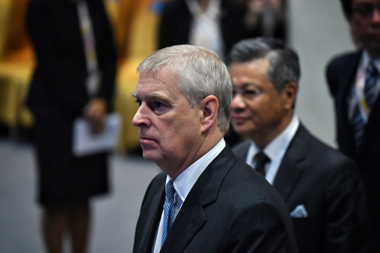 Britain's Prince Andrew, Duke of York (L) arrives for the ASEAN Business and Investment Summit in Bangkok on November 3, 2019, on the sidelines of the 35th Association of Southeast Asian Nations (ASEAN) Summit. (Photo by Lillian SUWANRUMPHA / AFP) (Photo by LILLIAN SUWANRUMPHA/AFP via Getty Images)