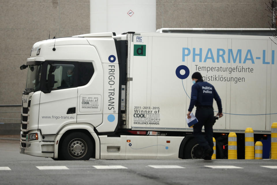A refrigerator truck leaves the loading bays at the Pfizer Manufacturing plant in Puurs, Belgium, Wednesday, Jan. 27, 2021. The 27-nation EU is coming under criticism for the slow rollout of its vaccination campaign. The bloc, a collection of many of the richest countries in the world, is not faring well in comparison to countries like Israel, the United Kingdom and the United States. (AP Photo/Francisco Seco)