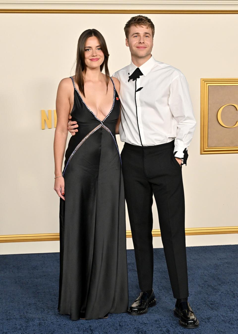 Meg Bellamy and Ed McVey attend the Los Angeles Premiere of Netflix's "The Crown" Season 6 Part 1 at Regency Village Theatre on November 12, 2023 in Los Angeles, California.