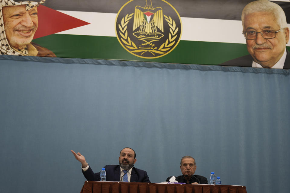 Palestinian Attorney General Akram Al Khateeb, left, and spokesperson for the Palestinian Presidency, Nabil Abu Rudeineh announce the results of the Palestinian investigation into the death of Palestinian-American Al-Jazeera journalist Shireen Abu Akleh, in the West Bank city of Ramallah, Thursday, May 26, 2022. Khateeb said the probe showed Israeli troops intentionally killed her during an army raid in the West Bank city of Jenin. Israel is likely to reject the findings as biased and unfounded. (AP Photo/Majdi Mohammed)