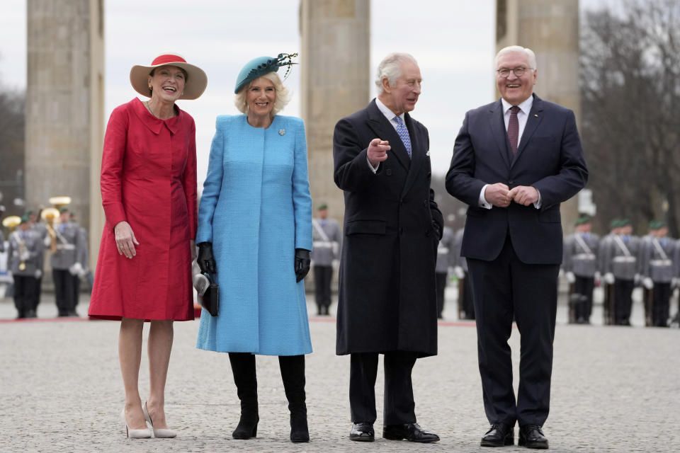 FILE - German President Frank-Walter Steinmeier, right, and his wife Elke Buedenbender, left, welcome Britain's King Charles III and Queen Camilla, in front of the Brandenburg Gate in Berlin, March 29, 2023. King Charles III is on the comeback trail. The 75-year-old British monarch will slowly ease back into public life after a three-month break to focus on his treatment and recuperation after he was diagnosed with an undisclosed type of cancer. (AP Photo/Matthias Schrader, File)
