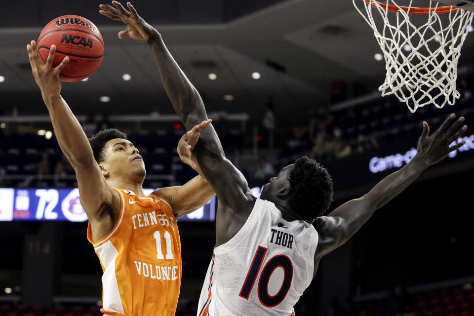 FILE - In this Feb. 27, 2021, file photo, Tennessee guard Jaden Springer (11) puts up a shot over Auburn forward JT Thor (10) during the second half of an NCAA basketball game in Auburn, Ala. Springer played one season with the Volunteers and is one of the top shooting guards in the NBA draft. (AP Photo/Butch Dill, File)