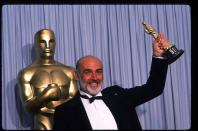 <p>Connery holds up his Best Actor in a Supporting Role Oscar for <em>The Untouchables</em> at the Academy Awards April 11, 1988</p>