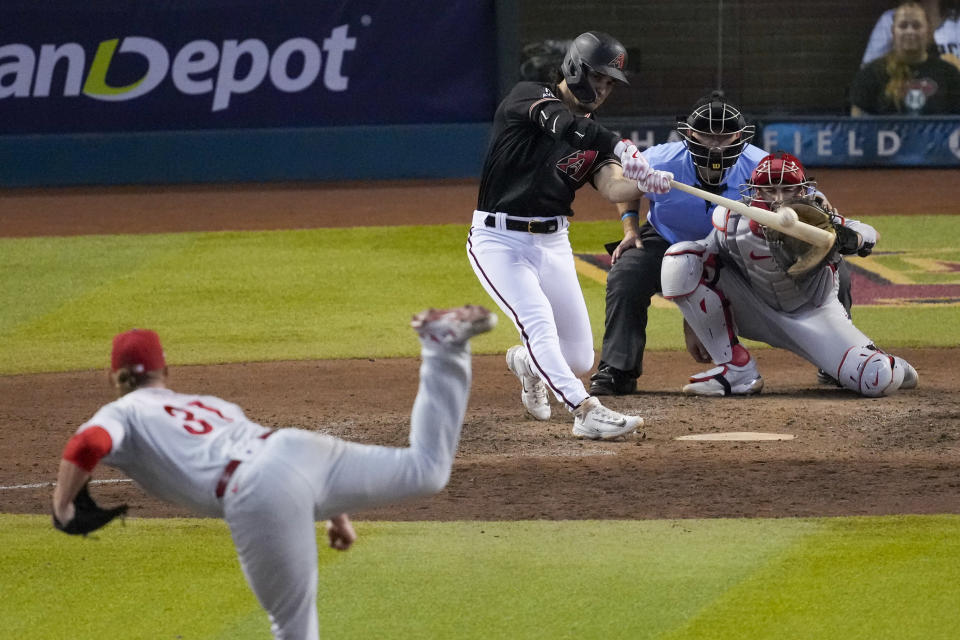 Arizona Diamondbacks' Alek Thomas hits a two-run home run off Philadelphia Phillies relief pitcher Craig Kimbrel during the eighth inning in Game 4 of the baseball NL Championship Series in Phoenix, Friday, Oct. 20, 2023. (AP Photo/Rick Scuteri)