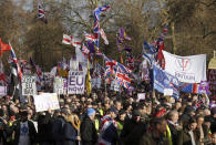 People attend the "Brexit Betrayal Rally", a pro-Brexit rally, on Park Lane in London, Sunday, Dec, 9, 2018. MP's are to vote on the EU withdrawal agreement on Tuesday. (AP Photo/Tim Ireland)