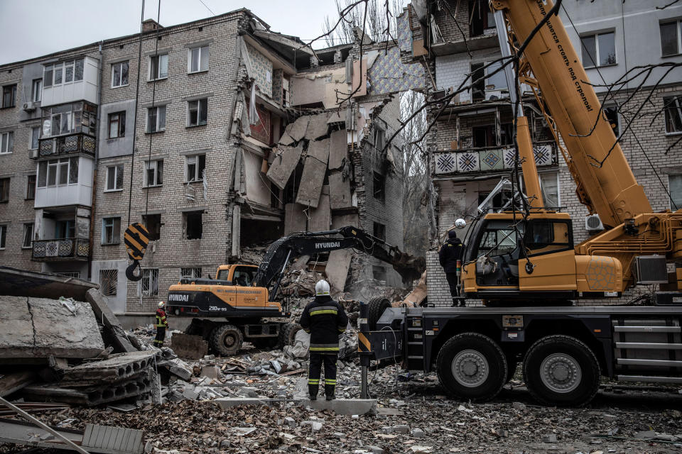 Rescue workers at a damaged apartment block in Mykolaiv on Nov. 11, 2022.<span class="copyright">Finbarr O'Reilly—The New York Times/Redux</span>