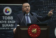 Turkey's President Recep Tayyip Erdogan addresses a business meeting in Ankara, Turkey, Monday, Jan. 21, 2019. Erdogan has told his American counterpart, Donald Trump, that Turkey's "ready to take over the security" of the key northern Syrian town of Manbij "without losing time." (Presidential Press Service via AP, Pool)