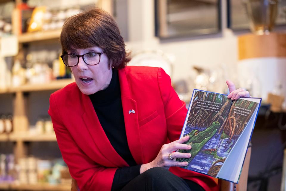 Gwen Graham reads her father's children's book "Rhoda the Alligator" to a small audience at Hearth and Soul on Sunday, Dec. 20, 2020.