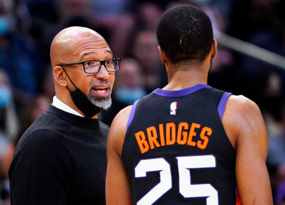 Nov 30, 2021; Phoenix, Arizona, USA; Phoenix Suns head coach Monty Williams talks to forward Mikal Bridges (25) during a time out against the Golden State Warriors at Footprint Center.