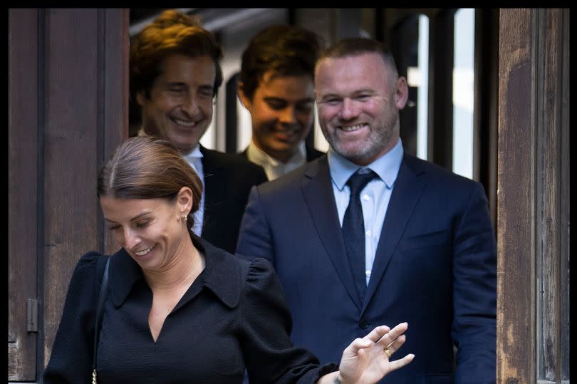 Coleen Rooney and her husband Wayne leaving the High Court