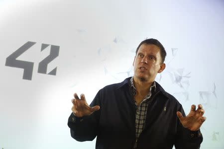 Peter Thiel, the Silicon Valley investor who co-founded PayPal, talks to students during his visit to the 42 school campus in Paris, France, February 24, 2016. REUTERS/Jacky Naegelen/File Photo