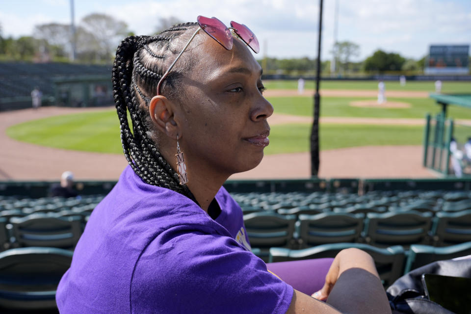 Sheila Moreno sits in the stands where her son Jadin is playing for Prairie View A&M University at the Andre Dawson Classic tournament, Friday, Feb. 23, 2024, at the Jackie Robinson Training Complex, in Vero Beach, Fla. The percentage of Black major league players has been declining for decades and remains historically low, but there are signs of improvement in the league's player development pipeline. (AP Photo/Lynne Sladky)