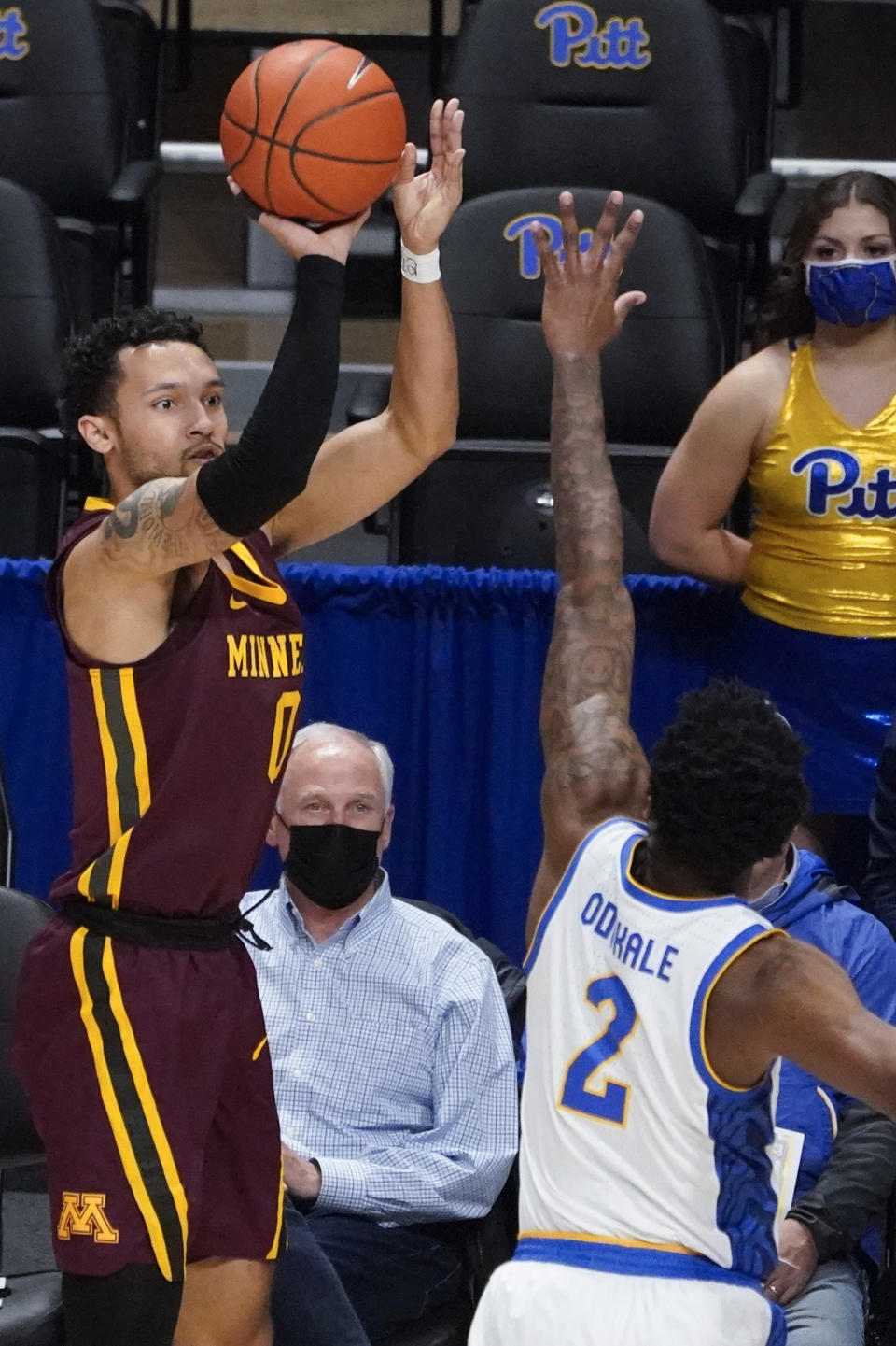 Minnesota's Payton Willis (0) hits a 3-point shot over Pittsburgh's Femi Odukale (2) during the first half of an NCAA college basketball game Tuesday, Nov. 30, 2021, in Pittsburgh. (AP Photo/Keith Srakocic)