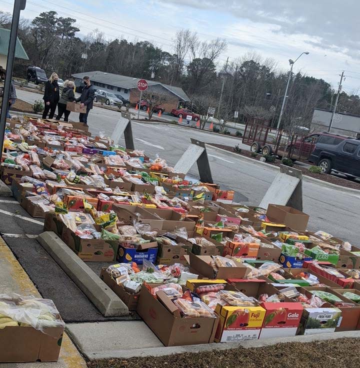 Onslow Community Outreach distributes thousands of pounds of food during a monthly food bank event.