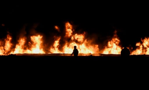 A Mexican soldier works at the scene of the deadly blaze that occurred during an illegal pipeline tap in Tlahuelilpan, Hidalgo state, Mexico