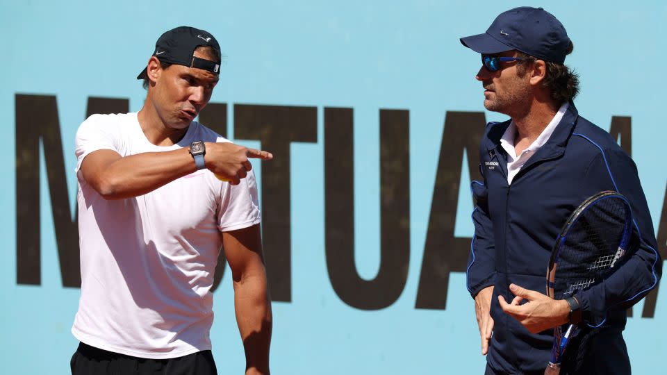 Nadal speaks to coach Carlos Moyá as he prepares to compete at the Madrid Open. - Clive Brunskill/Getty Images