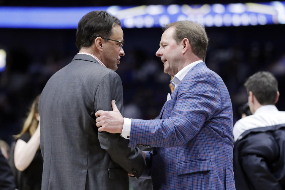 Georgia head coach Tom Crean, left, and Mississippi head coach Kermit Davis talk after an NCAA college basketball game in the Southeastern Conference Tournament Wednesday, March 11, 2020, in Nashville, Tenn. Georgia won 81-63. (AP Photo/Mark Humphrey)