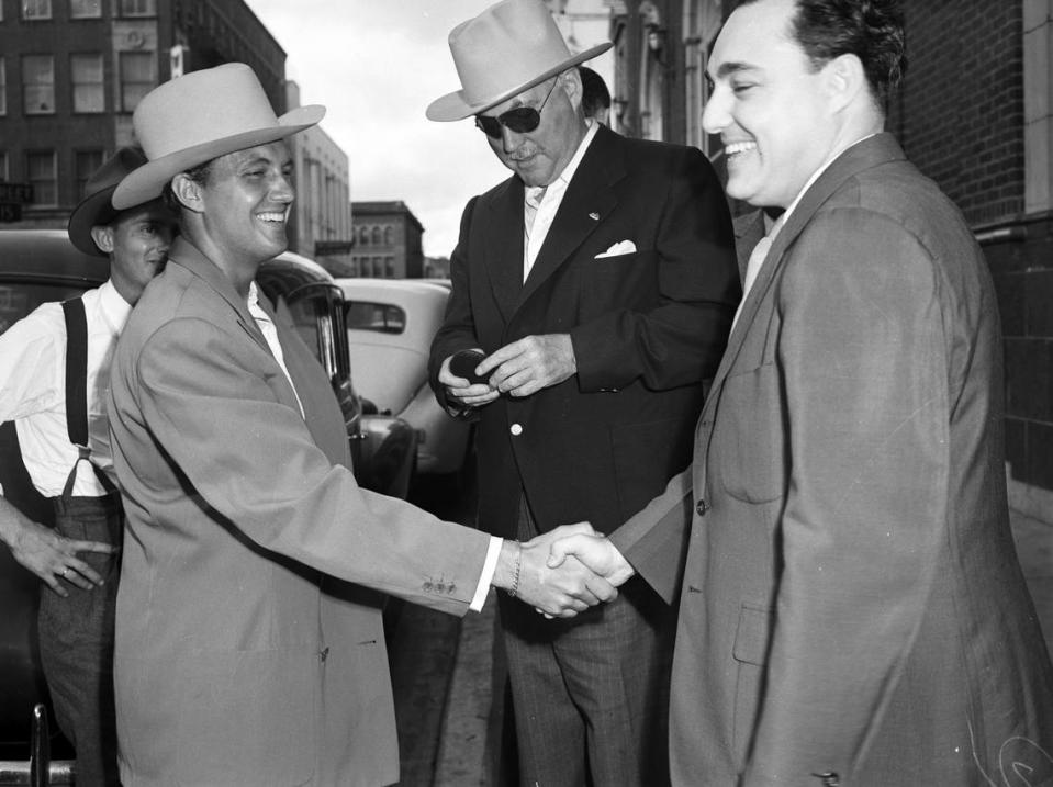 Sept. 18, 1942: Movie star Robert Stack shakes Nigel Bruce’s hand in Fort Worth for a war bond rally. At center is Al Broofsky of Galveston. Fort Worth Star-Telegram archives/UT Arlington Special Collections