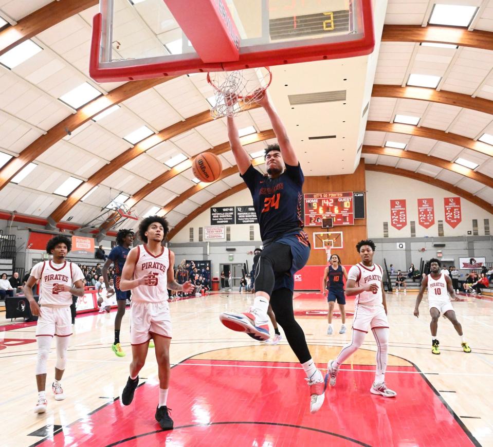 College of the Sequoias forward Terri Miller dunks against Porterville on Feb. 8 in a Central Valley Conference game.