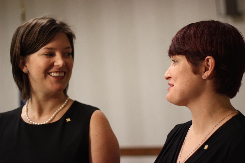 M. Lauren Brettner, left, and her wife, Jacqueline Brettner, smile while talking to reporters about a federal lawsuit filed Wednesday, Feb. 12, 2014, in New Orleans to challenge the Louisiana Constitution’s ban on recognizing same-sex marriages performed in states where they are legal. They are one of four couples who joined the Forum for Equality Louisiana in a suit against the state registrar and state revenue secretary. All four couples were married in states where such marriages are legal.They are among four couples, all married states where same-sex marriage is legal, who joined the Forum for Equality Louisiana in a suit against the state registrar and state revenue secretary. (AP Photo/Janet McConnaughey)