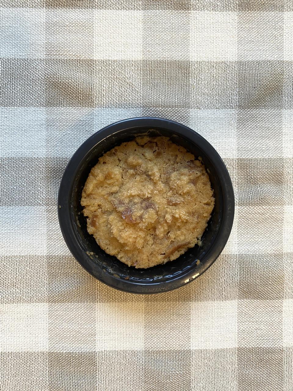 A frozen Pretzel Bread Pudding in a black plastic cup